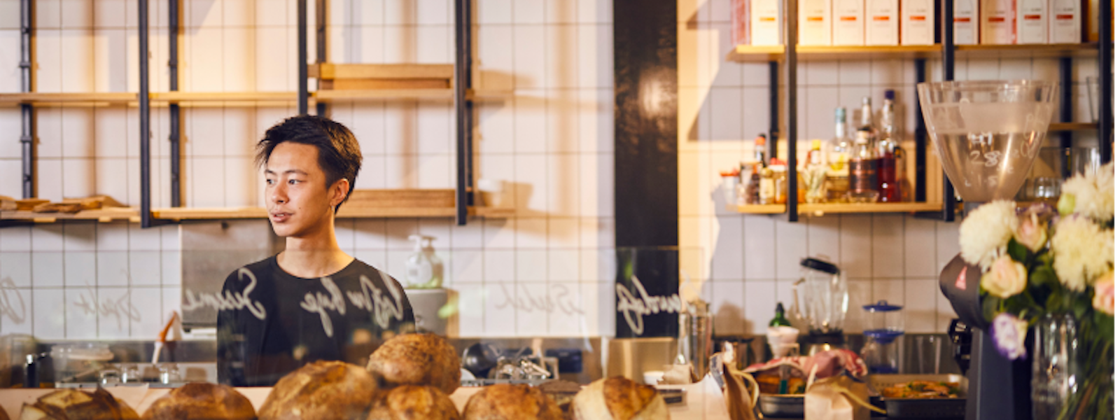 Man standing behind cafe
